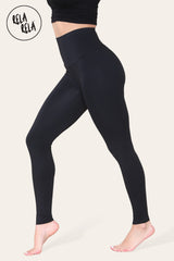 Side view of sculpting black leggings highlighting feminine silhouette