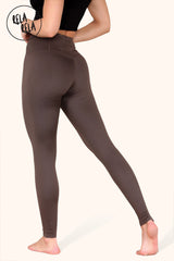 Back view of high waisted gym leggings in chocolate colour