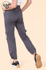 Back view of high waisted cargo pants for women with cuffed hems in charcoal