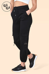 Side angle showing pocket details on ladies black cargo pants with stretch waistband