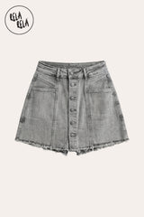 flat lay of the signature multi-button fastening on the Grey stretchy denim skorts, showcasing the fabric texture and the vintage-inspired hardware.