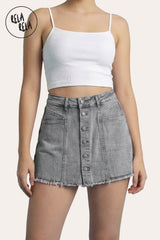 Front view of a model wearing the Rela Rela Grey multi-button stretchy denim skorts. Highlights the structured button-down detail and the flattering mid-rise sculpting fit.