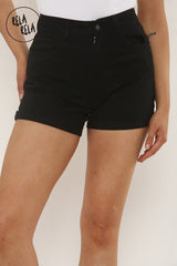 Close-up of stretch fabric on black elastic waist shorts for women