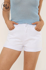 Close-up of stretch fabric on white elastic waist shorts for women