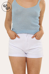 White turn up denim shorts styled with summer top, high waisted fit