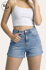 Blue stretchy high waisted denim shorts styled with summer top, elastic waist fit