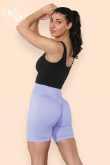 side view showcasing high waisted scrunch bum design on lilac gym shorts for women