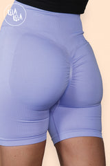 Back view showcasing ruched scrunch bum design on lilac gym shorts