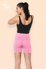 Back view of womens scrunch bum cycling shorts in pink