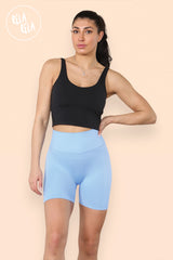 Model wearing high waisted baby blue scrunch bum shorts
