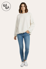 Model Styling view: white oversized long sleeve ruched hem jumper paired with jeans for casual layering.