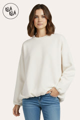 Front view of white oversized long sleeve jumper with a flattering ruched hem.