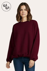 Front view of burgundy oversized long sleeve jumper with a flattering ruched hem.