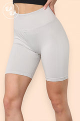 Close-up of waistband and Snug-fitting design on high waisted pink cycling shorts