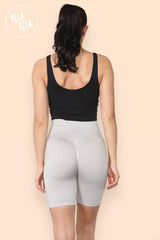 Back view showcasing ruched scrunch bum design on stone grey gym shorts