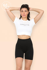 Model wearing high waisted black scrunch bum shorts