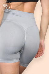 Back view showcasing ruched scrunch bum design on grey gym shorts