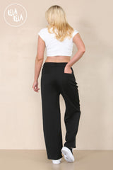 Back view of black tailored wide leg trousers showing flattering fit