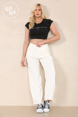 Model wearing cream going out trousers with heels – full outfit look