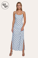 Front view of a model wearing the Blue Retro Polka Dot Slit Maxi Slip Dress, highlighting the crystalline sky-blue hue and the elegant scoop neckline.