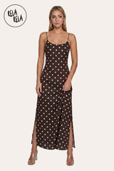 Front view of a model wearing the Chocolate Retro Polka Dot Slit Maxi Slip Dress, highlighting the rich cacao-hued drape and the minimalist scoop neckline.