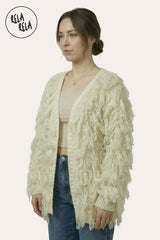 Side View of Fringe Decor Long Sleeve Knitted Cardigan in Cream