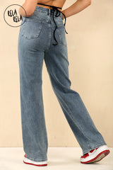 Back view showing rhinestone accents on denim blue wide leg stretchy jeans for women.