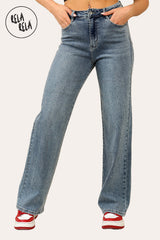 Woman wearing denim blue mid-waist wide leg jeans with rhinestone details, front view.