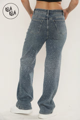 Back view of mid waist denim sparkle jeans with rhinestones and relaxed fit.