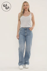 Model in mid blue sparkle jeans with rhinestone scatter and wide leg cut.
