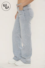 Side view of women's light blue viral stretch sparkle denim jeans with mid-waist fit.