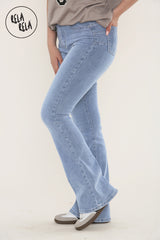 Side profile of high waist flared jeans in mid blue, pull-on stretch fit