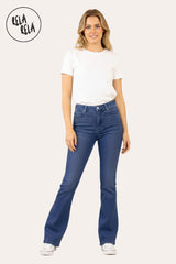 Model wearing indigo blue high waist flare jeans paired with casual street outfit to show elongated leg effect.