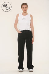 Model wearing mid waist rhinestone jeans in black, front angle