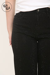 Detailed view of pull-on waistband on  denim jeans with rhinestone in black
