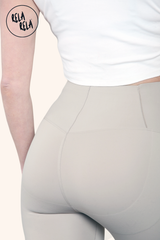 Detail shot of seamless stitching on bleach grey high waisted bum shaping leggings