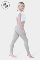 Side angle showing bleach grey sculpting leggings contouring the waist and hips