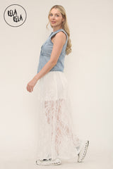 Soft and flowing white lace skirt with delicate sheer patterns