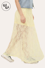 Side view of breathable patterned lace fabric on yellow maxi skirt