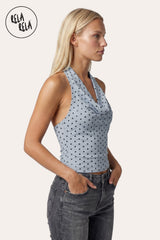 Side profile of the model in the Sky Blue mesh top, highlighting the delicate translucent layering of the fabric and the sculpted look of the halter neck from the side.