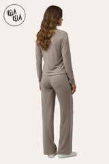 Back view of RELA RELA’s Taupe V-Neck Button Up Wide Leg Co-ord Set, showing the relaxed fit and elegant drape of the neutral Two-Piece.