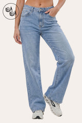 Front view of a model wearing Rela Rela Blue stretchy ripped jeans. Highlights the high-waisted, full-length fit and authentic indigo wash.