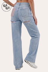 Other side Rear view of the Light Blue jeans showcasing the signature Diamante crystal back pockets and the body-sculpting stretch effect on the waist and hips.