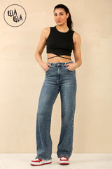 Model wearing high waisted stretchy wide leg jeans in denim blue