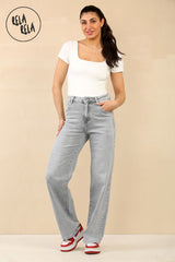 Model wearing high rise stretchy wide leg jeans in grey