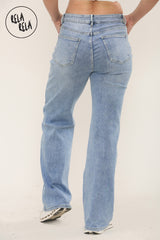 Back view of high waist jeans with stretch for women in mid blue