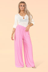 Front view of ladies wide leg trousers with elasticated waist in baby pink