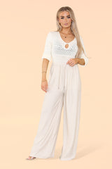 Front view of ladies beige wide leg elasticated trousers with versatile soft texture