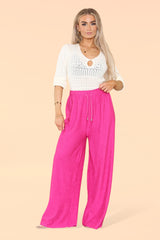 Stylish hot pink wide leg trousers with elasticated waistband and chic silhouette