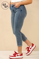 Side profile of denim blue petite cropped skinny jeans, showing 3/4 length and stretch fabric